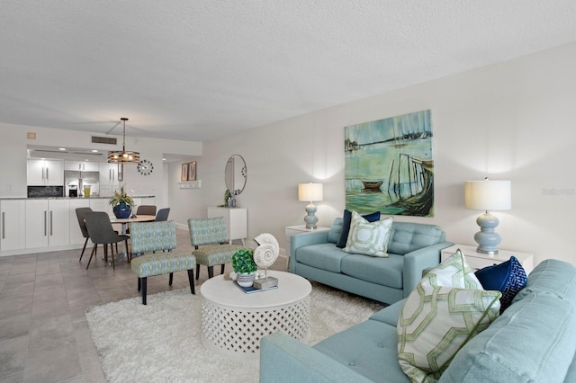 17920 Gulf Blvd Unit 1806, Redington Shores, FL 33708 - living area with a textured ceiling