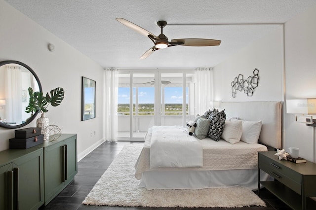 17920 Gulf Blvd Unit 1806, Redington Shores, FL 33708 - bedroom with access to exterior, ceiling fan, a textured ceiling, and baseboards