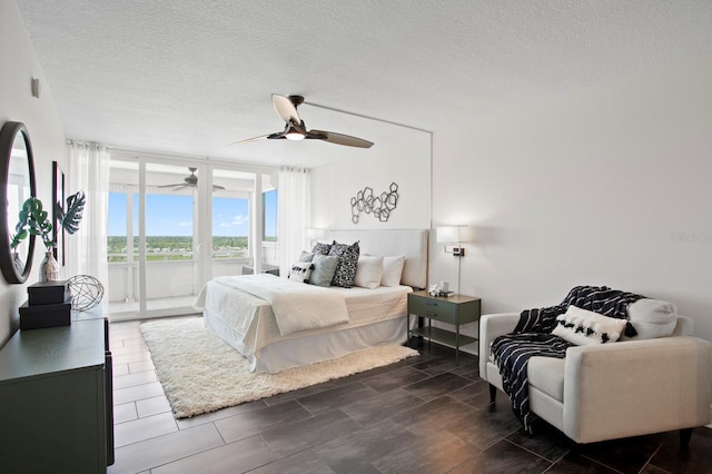 17920 Gulf Blvd Unit 1806, Redington Shores, FL 33708 - bedroom with access to outside, a textured ceiling, and a ceiling fan
