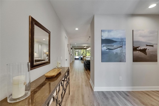 12957 Satin Lily Dr, Riverview, FL 33579 - hall featuring light wood-type flooring, recessed lighting, and baseboards