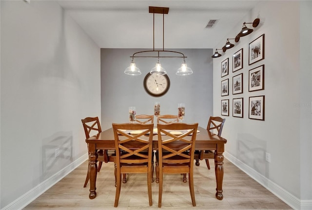 12957 Satin Lily Dr, Riverview, FL 33579 - dining space featuring light wood-style floors and baseboards
