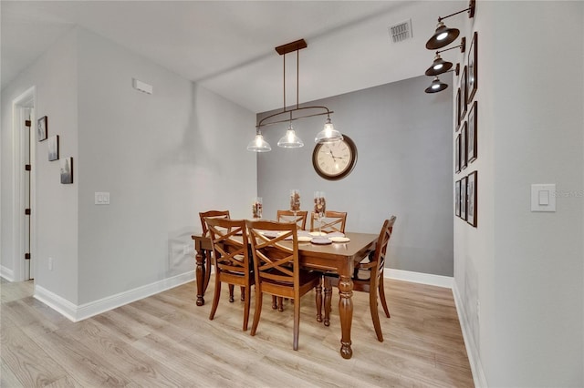 12957 Satin Lily Dr, Riverview, FL 33579 - dining area featuring light wood-style flooring and baseboards