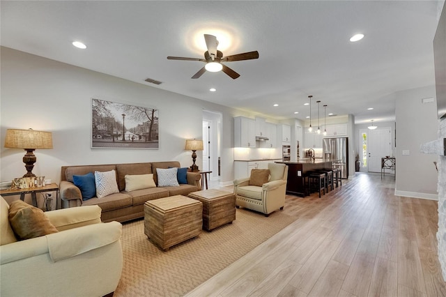 12957 Satin Lily Dr, Riverview, FL 33579 - living room featuring a ceiling fan, light wood-style floors, recessed lighting, and baseboards