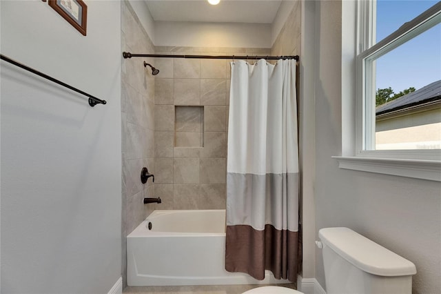 12957 Satin Lily Dr, Riverview, FL 33579 - bathroom with toilet, shower / bathtub combination with curtain, and baseboards