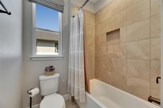 12957 Satin Lily Dr, Riverview, FL 33579 - full bathroom featuring plenty of natural light, toilet, shower / bath combo with shower curtain, and baseboards
