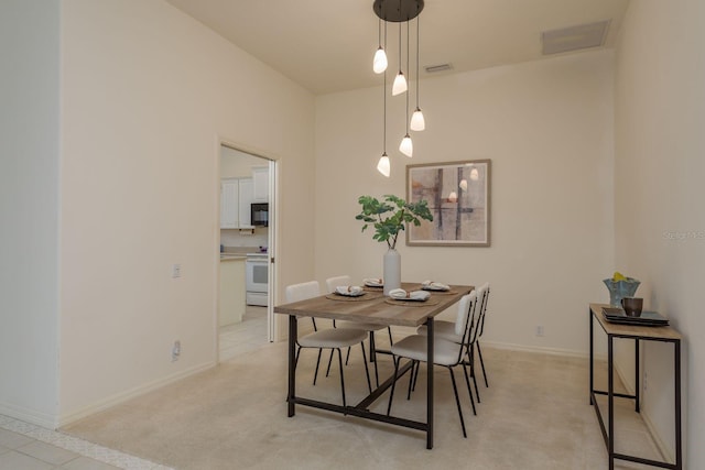 987 Chickadee Dr, Venice, FL 34285 - dining area with light carpet and baseboards