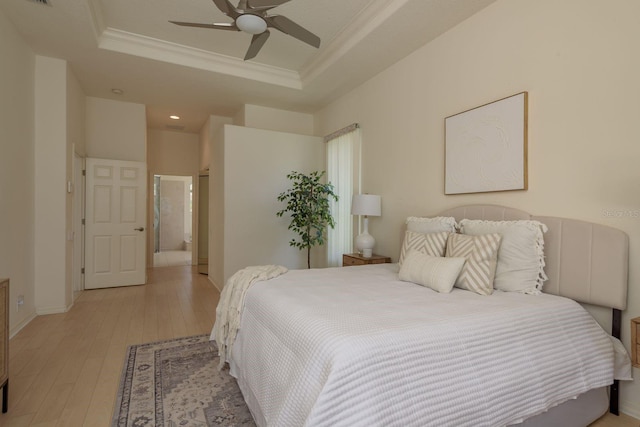 987 Chickadee Dr, Venice, FL 34285 - bedroom featuring a raised ceiling, ornamental molding, light wood-style flooring, recessed lighting, and baseboards