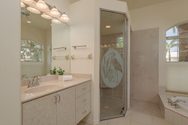 987 Chickadee Dr, Venice, FL 34285 - bathroom with vanity, a garden tub, a stall shower, and tile patterned floors