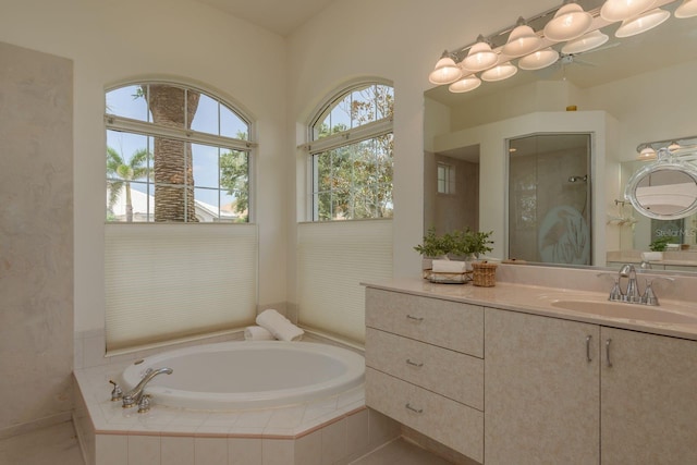 987 Chickadee Dr, Venice, FL 34285 - bathroom featuring a bath, vanity, ceiling fan, and a shower