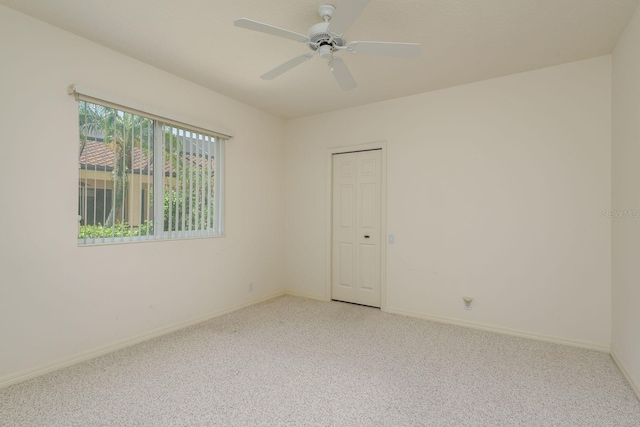 987 Chickadee Dr, Venice, FL 34285 - empty room featuring light colored carpet, baseboards, and a ceiling fan