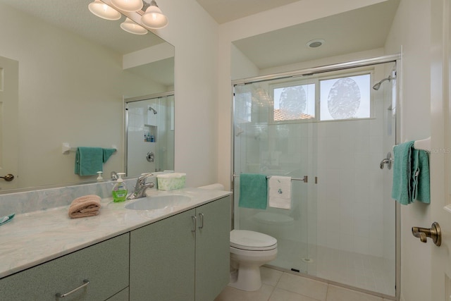 987 Chickadee Dr, Venice, FL 34285 - bathroom featuring vanity, a stall shower, toilet, and tile patterned floors