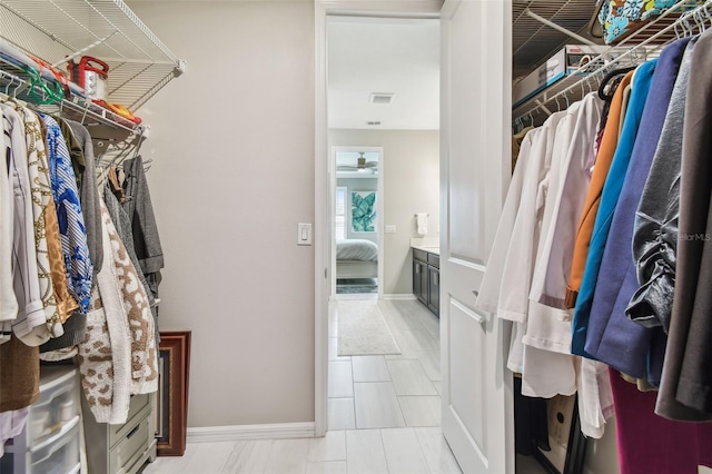 751 Cajeput Loop, Tarpon Springs, FL 34689 - walk in closet with a ceiling fan