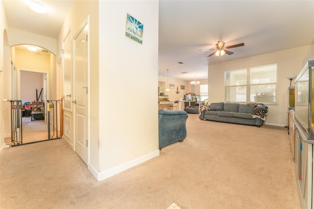 13803 Chalk Hill Pl, Riverview, FL 33579 - corridor with light carpet, arched walkways, and baseboards