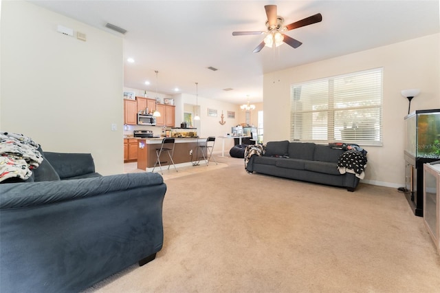13803 Chalk Hill Pl, Riverview, FL 33579 - living area with light colored carpet, ceiling fan, a chandelier, baseboards, and recessed lighting