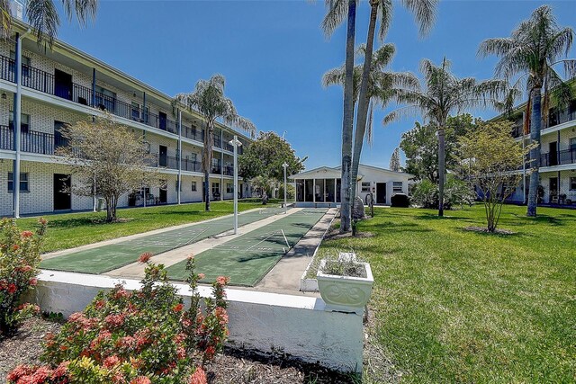 4050 4th St N Unit 205, Saint Petersburg, FL 33703 - view of community with a yard and shuffleboard