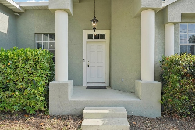 707 9th Ave SW, Ruskin, FL 33570 - doorway to property featuring stucco siding