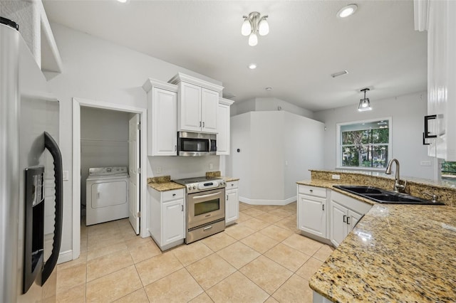 707 9th Ave SW, Ruskin, FL 33570 - kitchen with washer / clothes dryer, appliances with stainless steel finishes, a sink, white cabinets, and recessed lighting