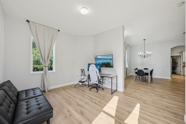 707 9th Ave SW, Ruskin, FL 33570 - office space with a chandelier, light wood-style floors, arched walkways, and baseboards
