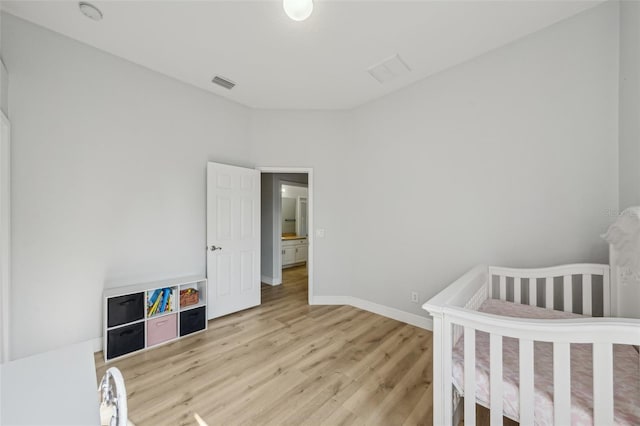 707 9th Ave SW, Ruskin, FL 33570 - bedroom featuring light wood-style floors and baseboards