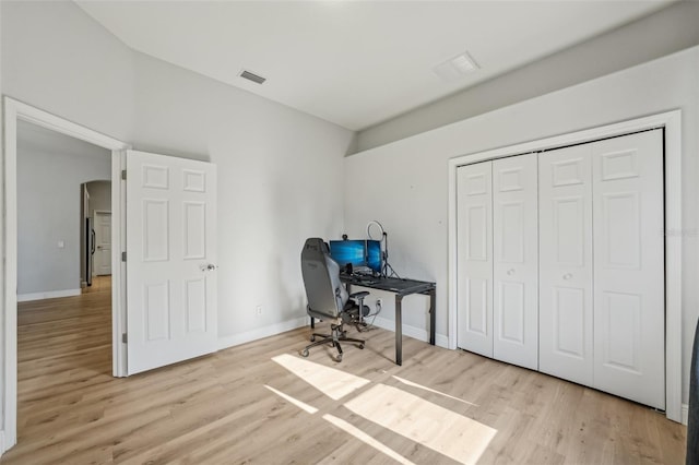 707 9th Ave SW, Ruskin, FL 33570 - office area with light wood-type flooring, baseboards, and arched walkways