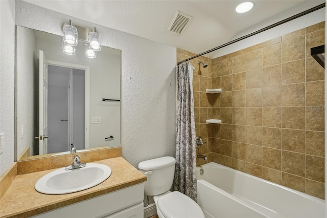 707 9th Ave SW, Ruskin, FL 33570 - full bath with a textured wall, vanity, shower / bath combo, and toilet