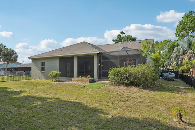 707 9th Ave SW, Ruskin, FL 33570 - rear view of property featuring stucco siding and a sunroom