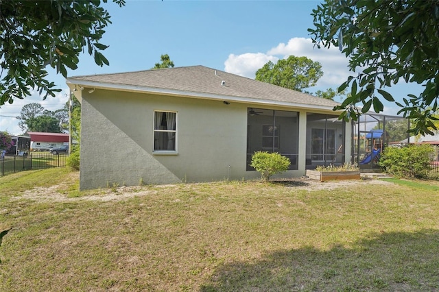 707 9th Ave SW, Ruskin, FL 33570 - rear view of house featuring stucco siding and a sunroom