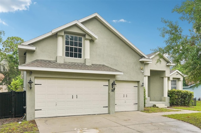707 9th Ave SW, Ruskin, FL 33570 - traditional-style house featuring stucco siding, a garage, concrete driveway, and roof with shingles