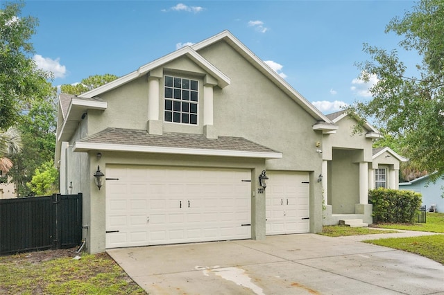 707 9th Ave SW, Ruskin, FL 33570 - traditional-style house with stucco siding, an attached garage, concrete driveway, and roof with shingles