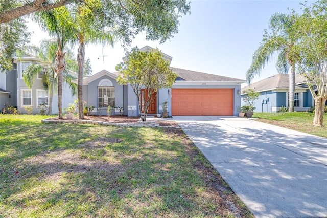 12136 Luftburrow Ln, Hudson, FL 34669 - view of front of house featuring stucco siding, an attached garage, driveway, and a front lawn