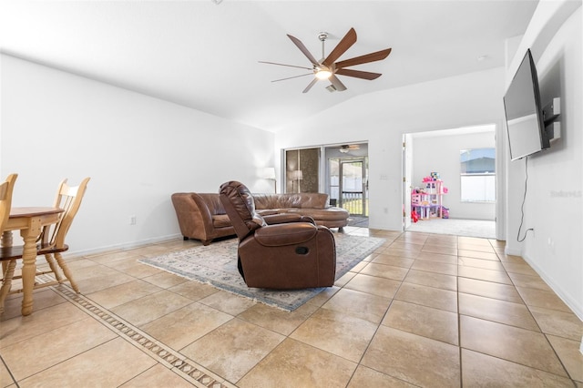 12136 Luftburrow Ln, Hudson, FL 34669 - living room featuring a ceiling fan, vaulted ceiling, and light tile patterned floors