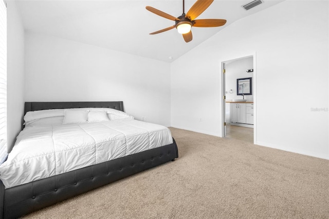12136 Luftburrow Ln, Hudson, FL 34669 - carpeted bedroom with vaulted ceiling, connected bathroom, baseboards, and a ceiling fan