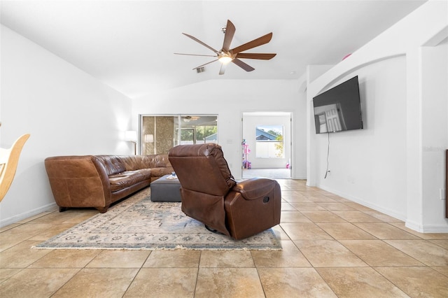 12136 Luftburrow Ln, Hudson, FL 34669 - living area with ceiling fan, lofted ceiling, baseboards, and light tile patterned flooring