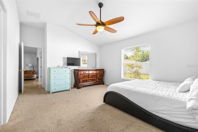 12136 Luftburrow Ln, Hudson, FL 34669 - bedroom featuring light carpet, lofted ceiling, ceiling fan, and baseboards