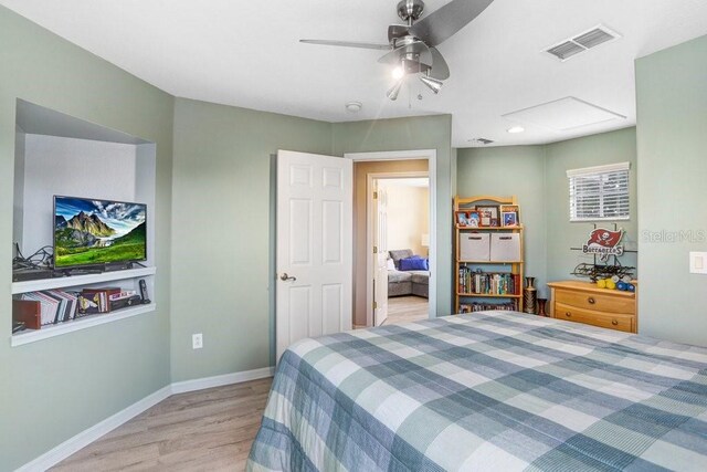 5525 Turtle Crossing Loop, Tampa, FL 33625 - bedroom featuring light wood-type flooring, baseboards, and ceiling fan