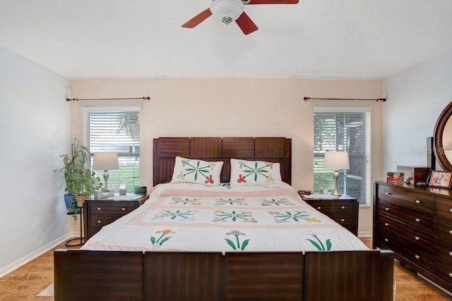 5525 Turtle Crossing Loop, Tampa, FL 33625 - bedroom featuring light wood-type flooring, baseboards, and ceiling fan