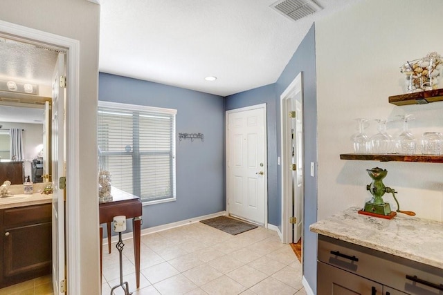5525 Turtle Crossing Loop, Tampa, FL 33625 - foyer featuring baseboards and light tile patterned floors