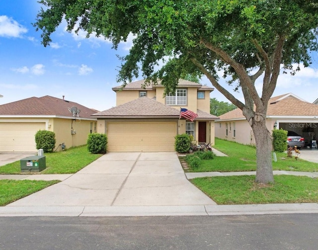 5525 Turtle Crossing Loop, Tampa, FL 33625 - traditional-style house featuring stucco siding, a front yard, a garage, and concrete driveway