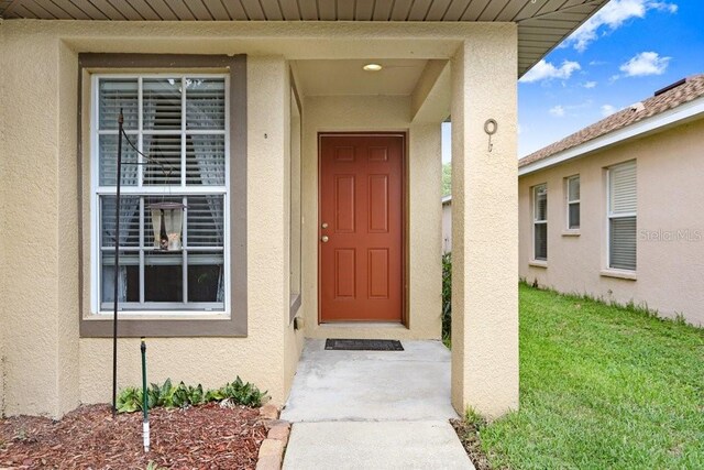 5525 Turtle Crossing Loop, Tampa, FL 33625 - view of exterior entry featuring stucco siding