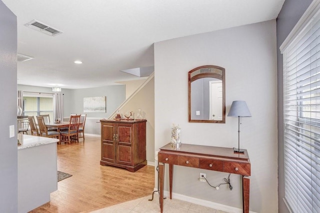 5525 Turtle Crossing Loop, Tampa, FL 33625 - corridor featuring baseboards, light wood-style floors, recessed lighting, and stairway