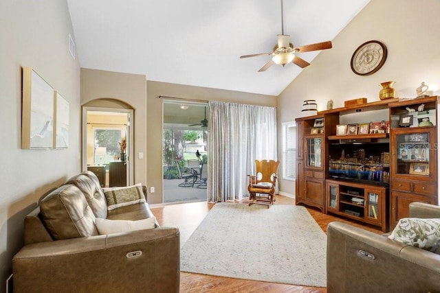 5525 Turtle Crossing Loop, Tampa, FL 33625 - living area featuring ceiling fan, high vaulted ceiling, wood finished floors, and baseboards