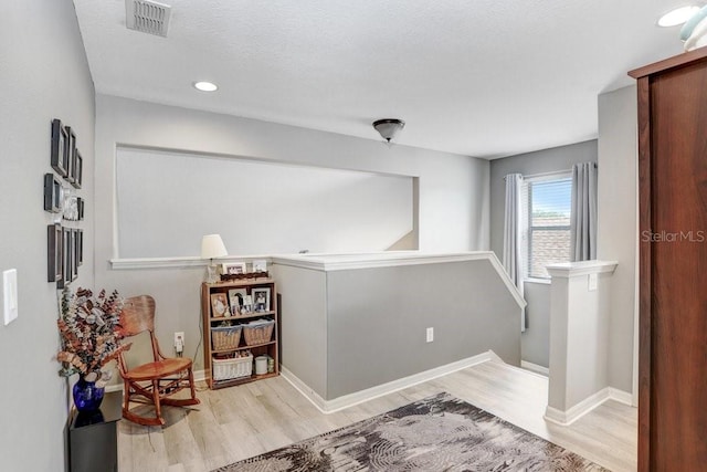 5525 Turtle Crossing Loop, Tampa, FL 33625 - hall with wood finished floors, an upstairs landing, baseboards, and recessed lighting