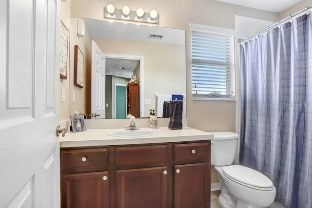 5525 Turtle Crossing Loop, Tampa, FL 33625 - bathroom featuring vanity, toilet, and a shower with curtain