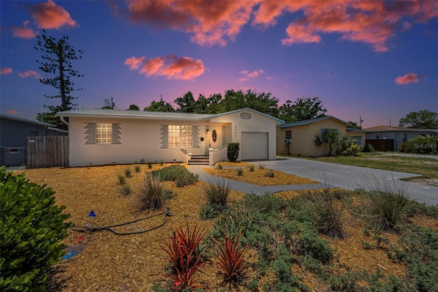 5642 9th Ave N, Saint Petersburg, FL 33710 - ranch-style home featuring driveway, an attached garage, stucco siding, and central air condition unit