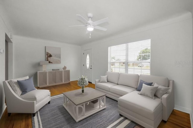 5642 9th Ave N, Saint Petersburg, FL 33710 - living area with plenty of natural light, a ceiling fan, and wood finished floors