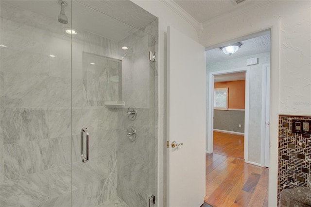 31 Freshwater Dr, Palm Harbor, FL 34684 - bathroom with wood finished floors, a stall shower, and ornamental molding