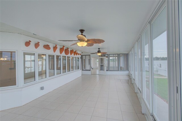 31 Freshwater Dr, Palm Harbor, FL 34684 - unfurnished sunroom featuring a ceiling fan and tile patterned floors