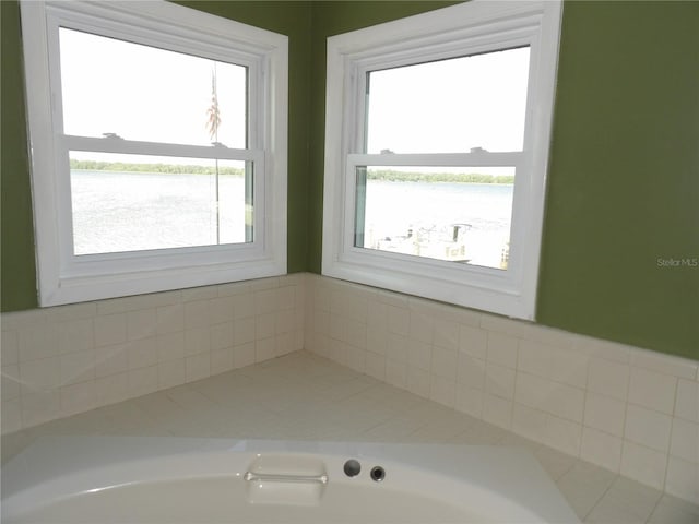 31 Freshwater Dr, Palm Harbor, FL 34684 - full bathroom featuring a water view and a tub to relax in