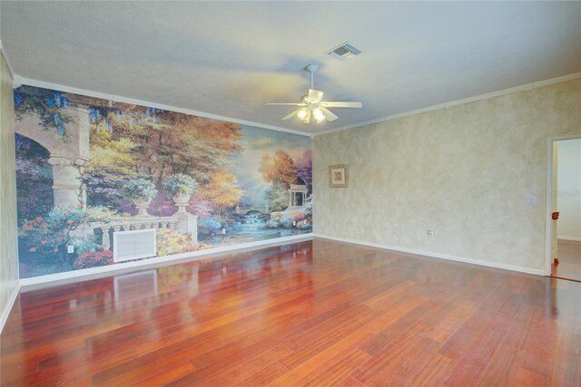 31 Freshwater Dr, Palm Harbor, FL 34684 - spare room featuring wood finished floors, ceiling fan, baseboards, and ornamental molding