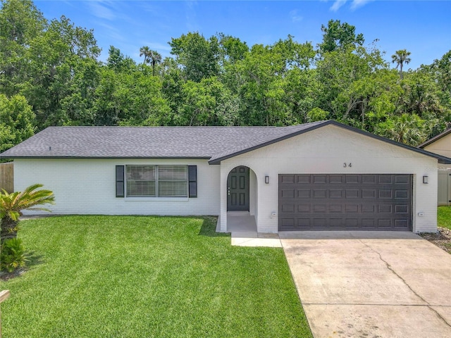 34 Aaron Cir, Ormond Beach, FL 32174 - ranch-style house featuring an attached garage, brick siding, concrete driveway, and a front lawn